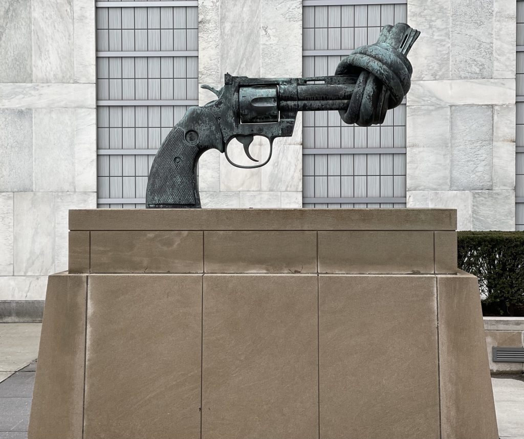 The Knotted Gun sculpture at the United Nations in New York, photographed by Lynnea Bylund on Gandhi’s death anniversary — symbolizing peace, restraint, and the enduring power of Ahimsa.